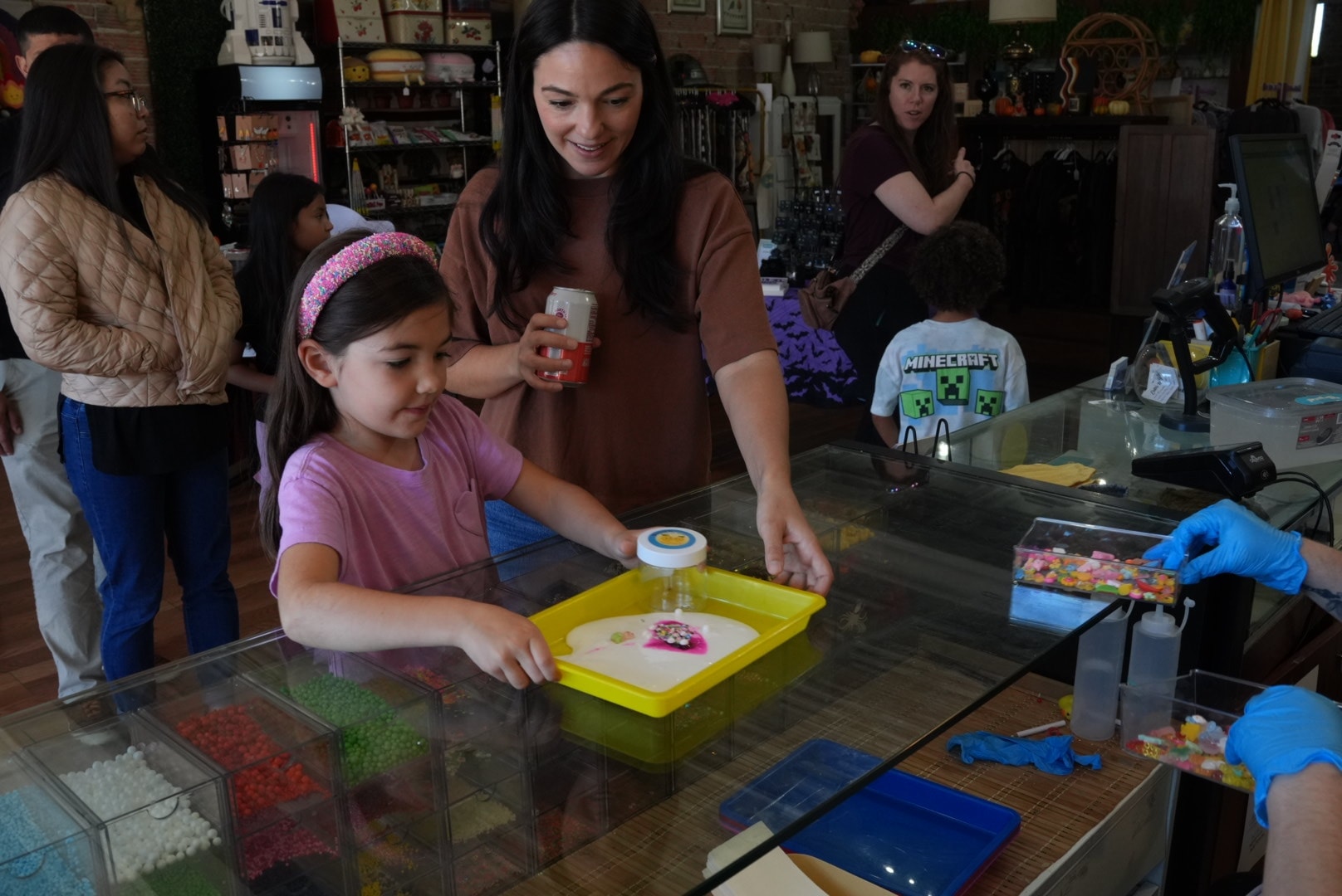 Children choosing slime mix-ins at Lemonade Gifts birthday party